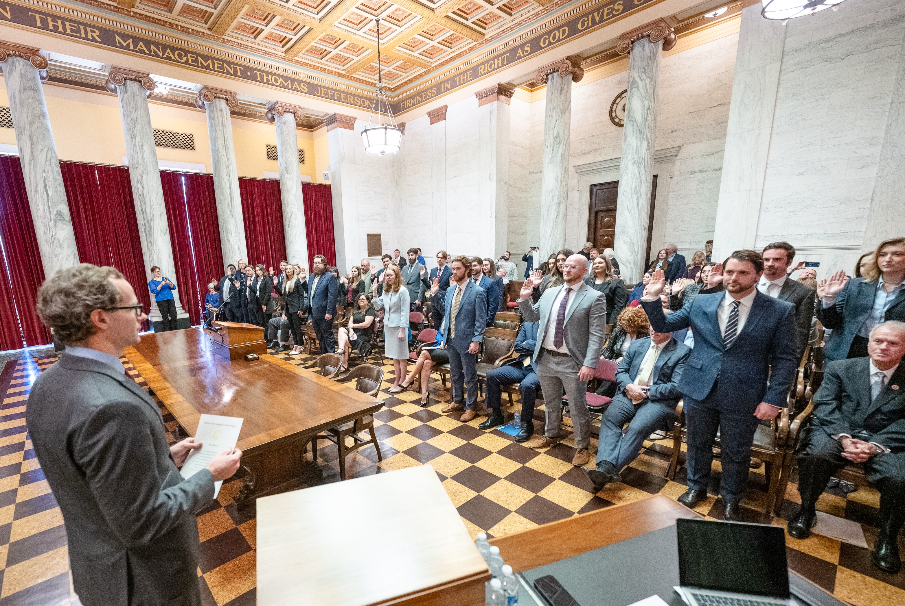 C. Casey Forbes, Clerk of the Supreme Court of Appeals of West Virginia, administers the oath to new attorneys during a bar admissions ceremony.